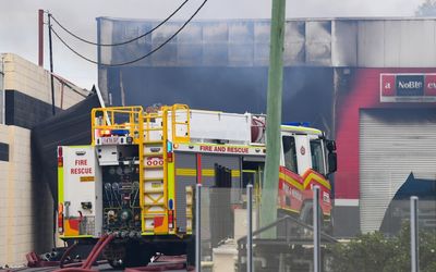 Firefighter dies after battling factory blaze