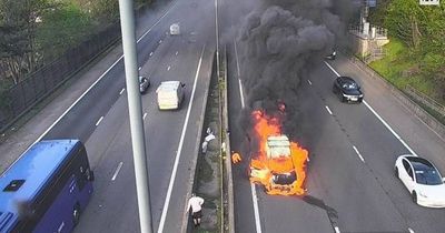 Major UK motorway blocked after car bursts into flames during rush hour