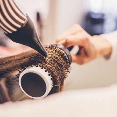 You *can* blow dry your own hair at home—you just need to know these tips