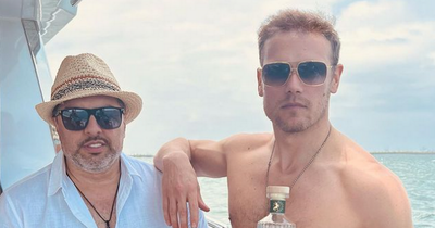 Sam Heughan poses on a yacht ahead of the release of his new Wild Scottish gin