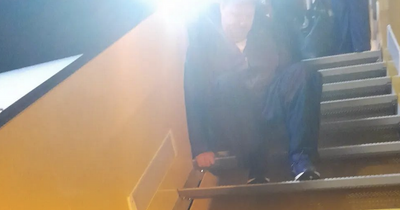 Shocking picture shows Irish Ryanair passenger in wheelchair forced to crawl down steps of flight
