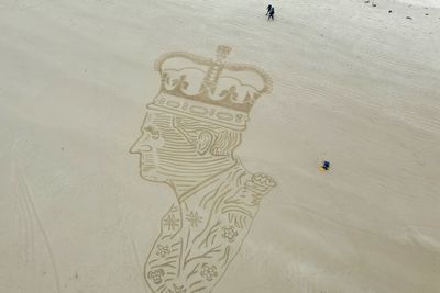 Creator behind 90ft sand drawing of King says the art is ‘super poignant’
