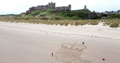 King Charles sand art appears on Bamburgh Beach to mark coronation