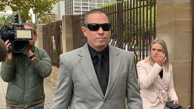 SA Police officer dropped detainee on gutter's edge after kneeling on head and neck, court told