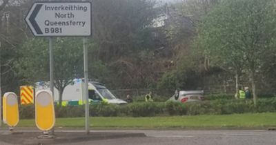 Person rushed to hospital after car flips onto roof in Scottish village