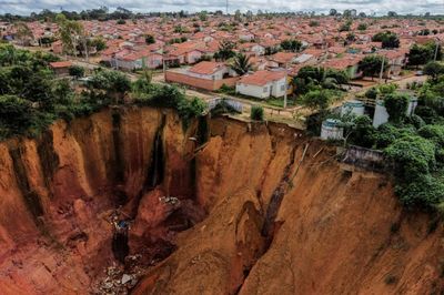 In Brazil, a damaged city lives on edge of abyss