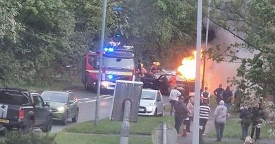 Shocking moment car bursts into flames with two rushed to hospital