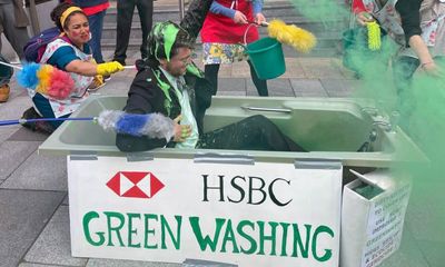 HSBC investors reject plan to split bank in meeting disrupted by climate protest