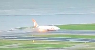 Passengers' shock as plane’s engine bursts into flames on runway moments before take off
