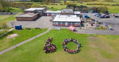 Stunning aerial picture captures moment entire school form giant 60 for anniversary celebrations