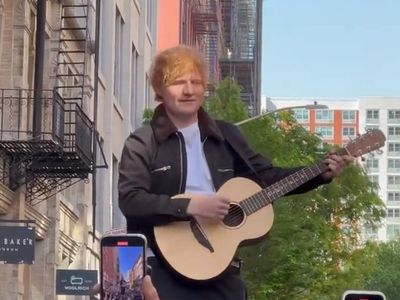 Ed Sheeran serenades fans on the roof of a car in New York after legal victory