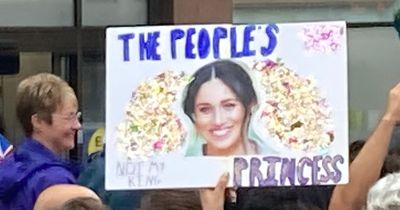 Royal protestors hold Meghan Markle 'people's princess' banner in attack on Charles