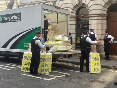 Pictures show police confiscating 'Not My King' posters before coronation