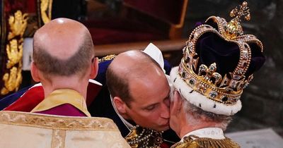 Touching moment shared between William and Charles as Harry cranes his neck to watch