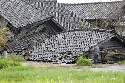 Aftershocks shake Japan after quake kills one, destroys homes