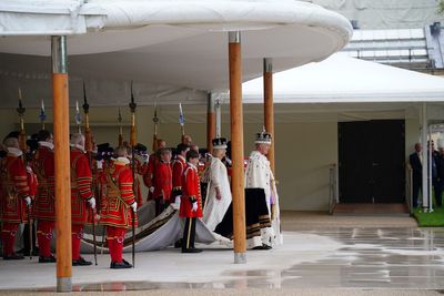 King and Queen receive royal salute and three cheers in Buckingham Palace garden