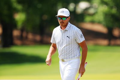 Rickie Fowler puts his wedge to work Saturday, picking up a snake at the Wells Fargo Championship