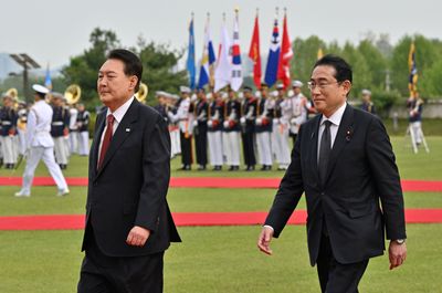 Japan's PM tells South Koreans his 'heart hurts' over pain caused by occupation