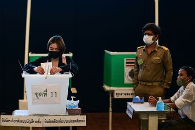 Thais queue at temples, schools as early voting begins