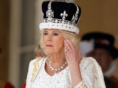 The secret names and themes embroidered into Camilla’s coronation gown