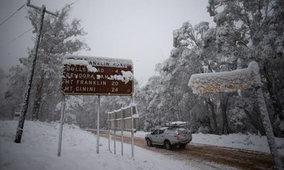 Eastern Australia wakes up to cold weather, snow, wild surf and flight cancellations