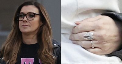 Glum Kym Marsh ditches wedding ring as she's seen for first time since marriage split