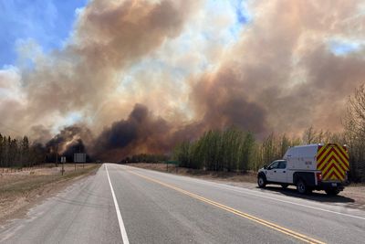Canadian fire crews battle blazes in western province of Alberta