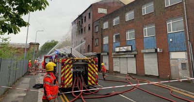 Smoke seen for miles around as huge fire breaks out in three-storey building