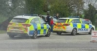 Police smash window to free crying baby from hot car after stranger spots her crying