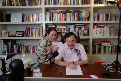Thaksin wants to come home, 'enter legal process'