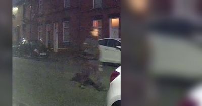 Couple asleep in their bed wake to see three men stood over them with knives