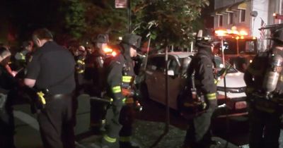 Woman dead and four children critical after fire which may have been started deliberately