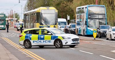 Woman rushed to hospital after car and tram crash on busy road