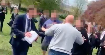 Dads brawl in field in front of screaming schoolkids in fight 'over sons'