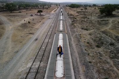 Migrants risk life and limb to jump Mexico trains in rush to border