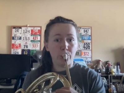 Delta customer on phone to airline for so long she performs French horn jam to hold music