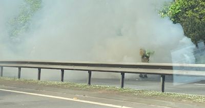 Edinburgh emergency services race to car engulfed in flames on city bypass