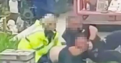 Police force releases statement after shocking video shows 'officer attacking man'