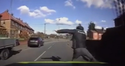 Footage shows police car deliberately knocking teen off motorbike after doing wheelie