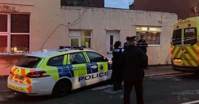 Six people arrested after armed police in 'standoff' on street