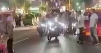 Moment arrested Brit tourist launches attack on Thailand tuk tuk driver in street brawl