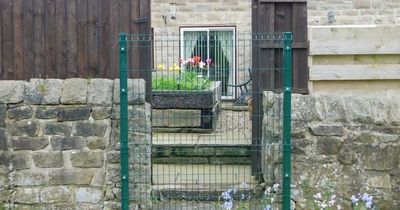 'Spiteful' council fences off residents' garden gates in 'row over car park sale'