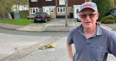 Frustrated man's last resort response to get pothole-ridden street fixed