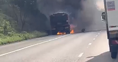 Lorry englufed by fire on busy motorway causes tailbacks for five miles
