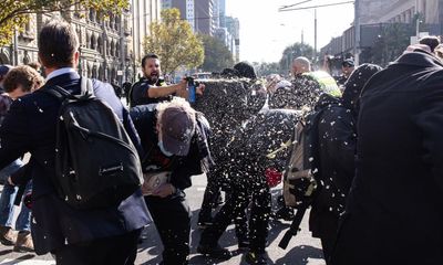 Neo-Nazis clash with police and counter-protesters at anti-immigration rally in Melbourne