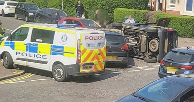 Edinburgh crash sees car flipped onto its side leaving passengers shaken