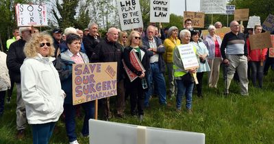 Entire village marches in fury to demand their GP surgery isn't moved away