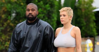 Kanye West looks very loved up with new 'wife' as they step out hand-in-hand