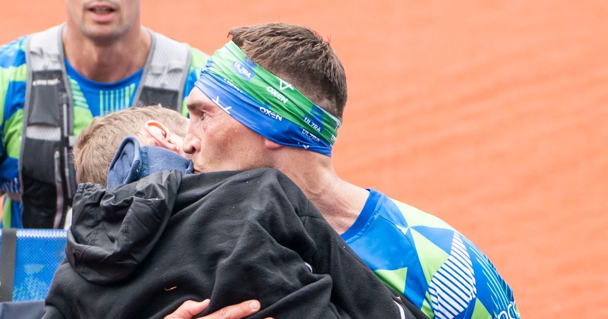 Kevin Sinfield kisses Rob Burrow and carries him over…