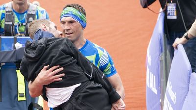 Kevin Sinfield carries ex-teammate Rob Burrow over line in Leeds Marathon raising funds to fight motor neurone disease